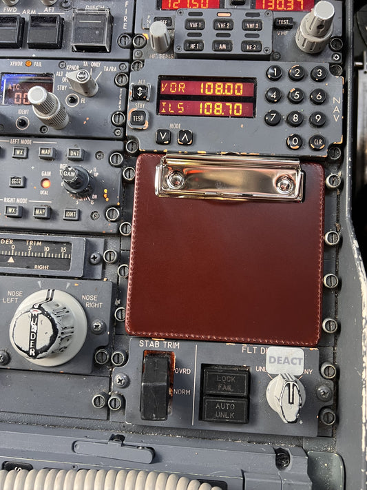 Leather pilot clipboard inside a Boeing 737 cockpit