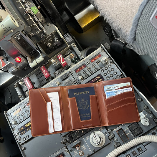 Lindbergh leather passport wallet for pilots displayed inside a Boeing 737 cockpit