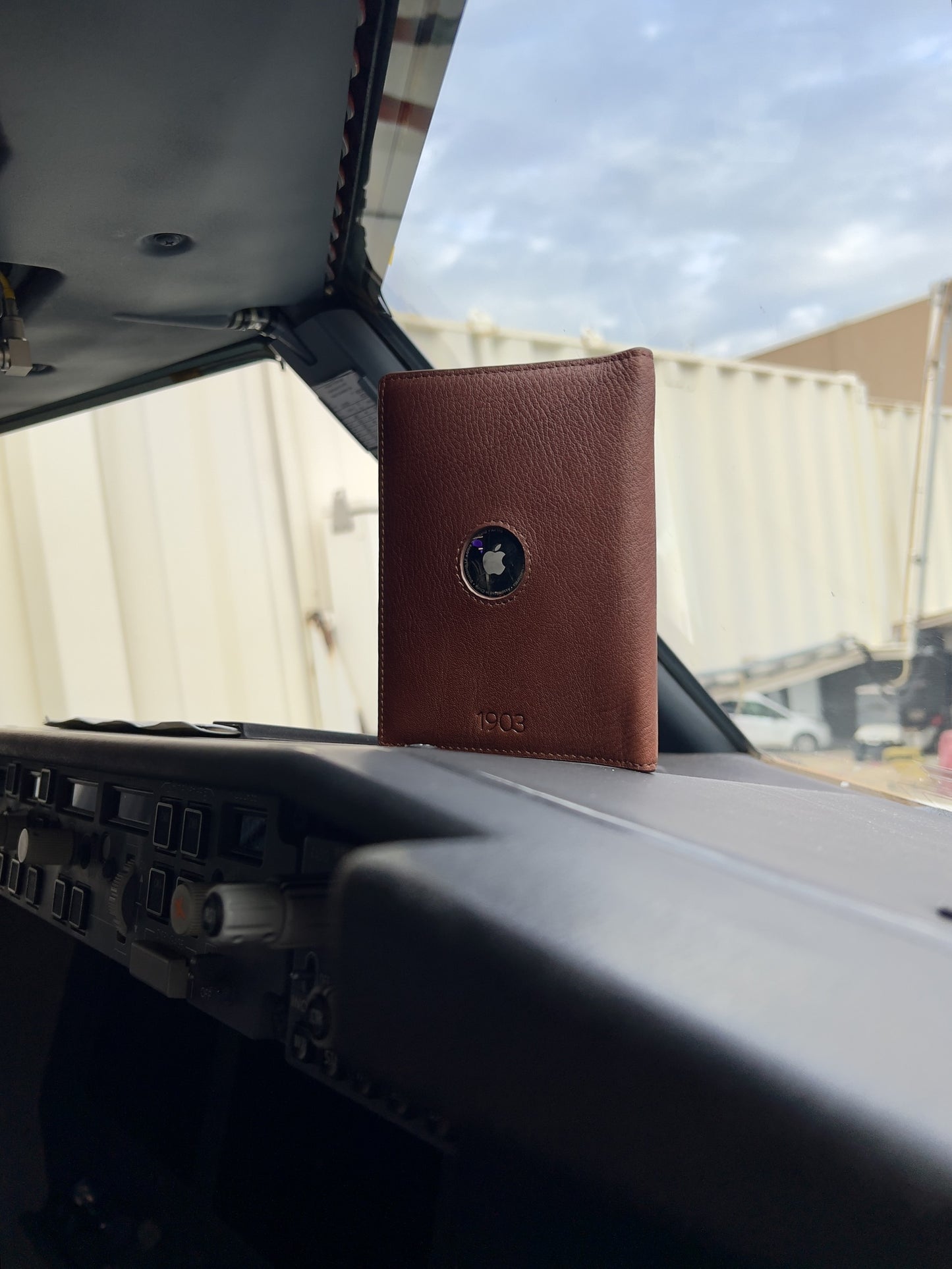 1903 2.0 leather pilot wallet inside a Boeing 737 cockpit