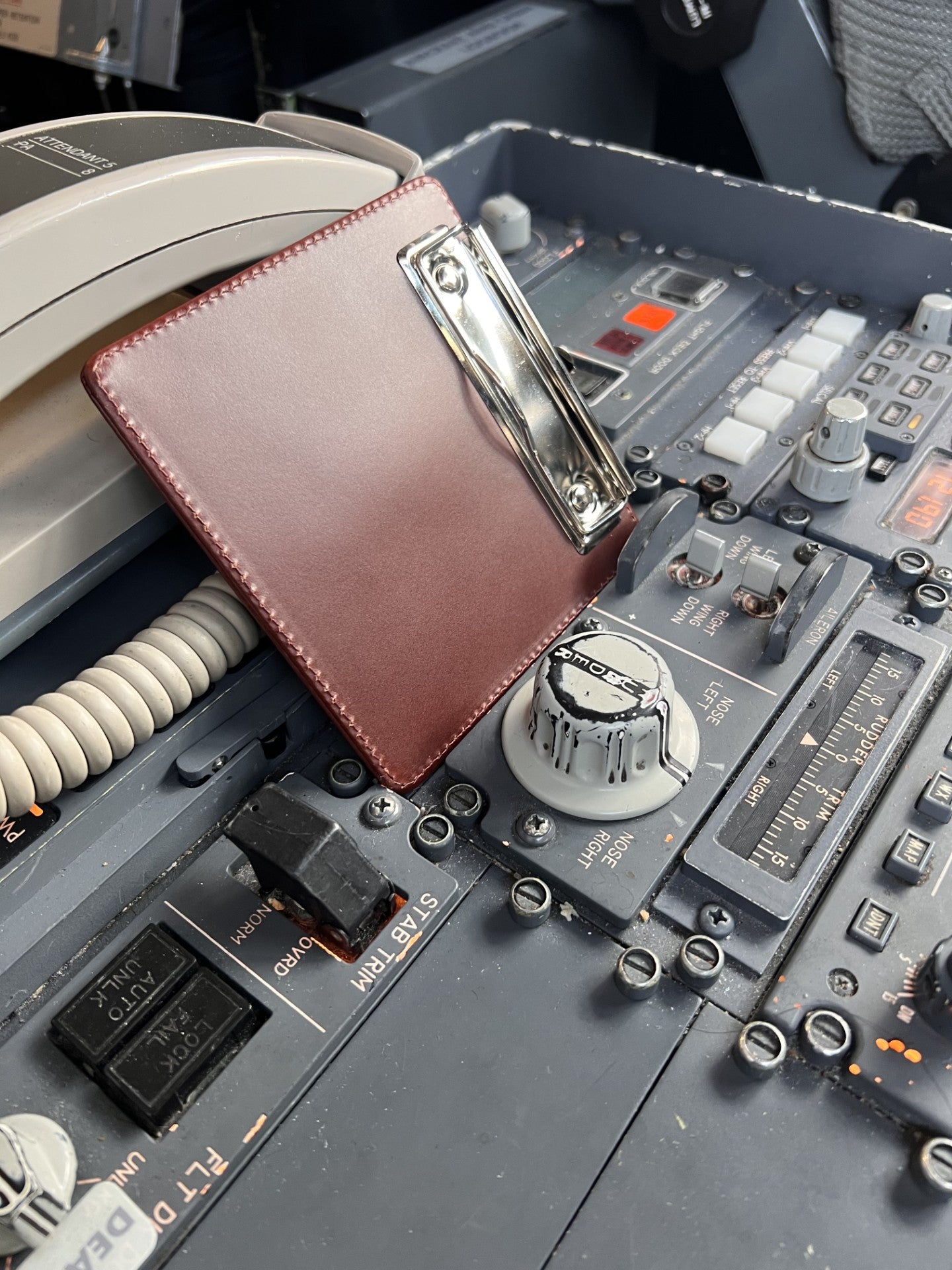 Slim leather flight clipboard on pedestal 