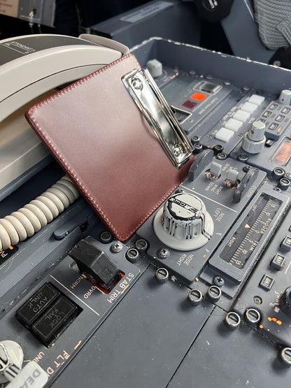Slim leather flight clipboard on pedestal 