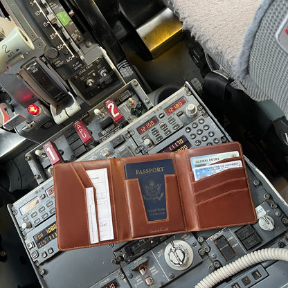 Lindbergh leather passport wallet for pilots displayed inside a Boeing 737 cockpit